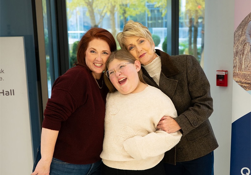 new-photo crop Three women smiling together.