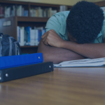 Boy asleep at school