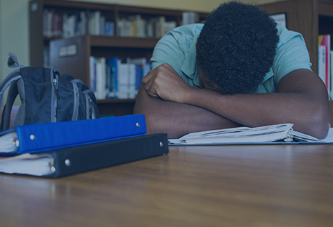 Boy asleep at school